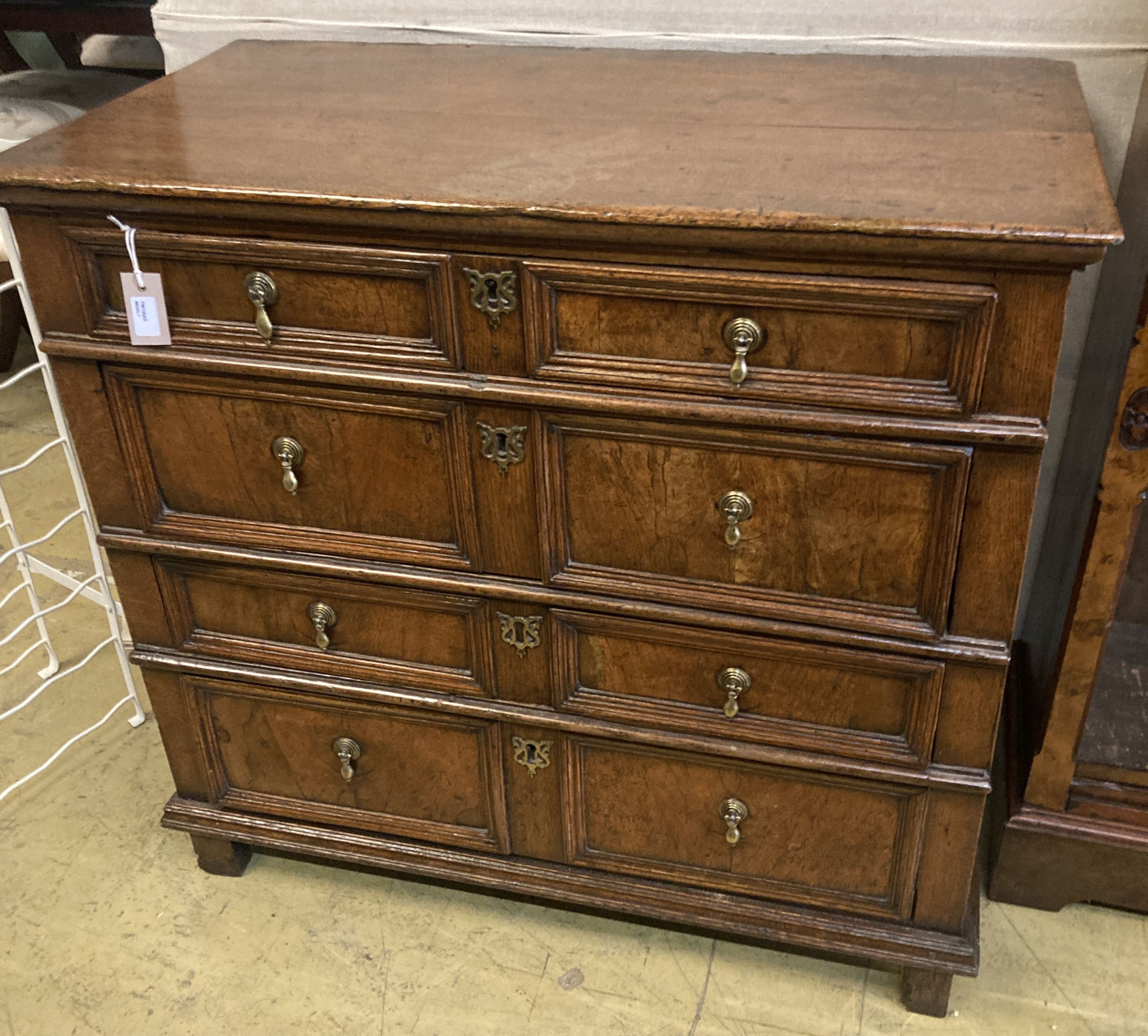 An oak and walnut chest, circa 1700, fitted two short drawers and three long drawers with mitred moulding